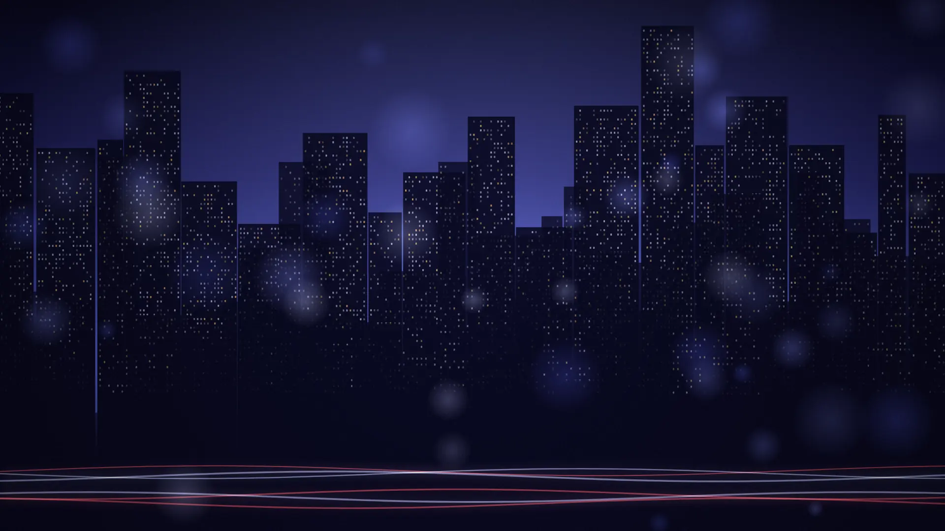 City skyline at night with lit office towers